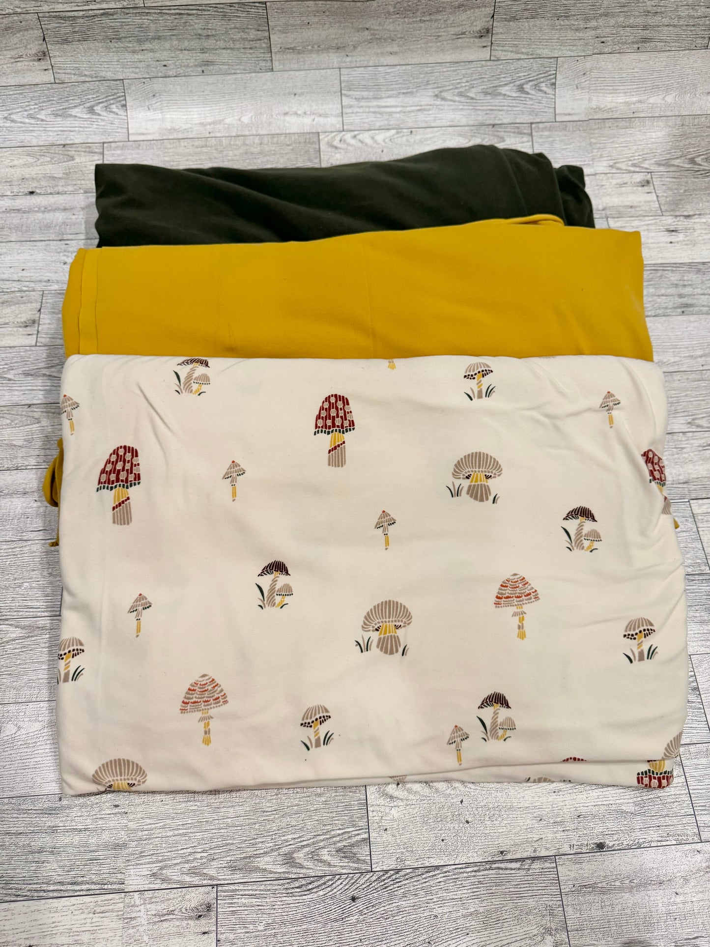 Fabric - Red, green and mustard Mushrooms